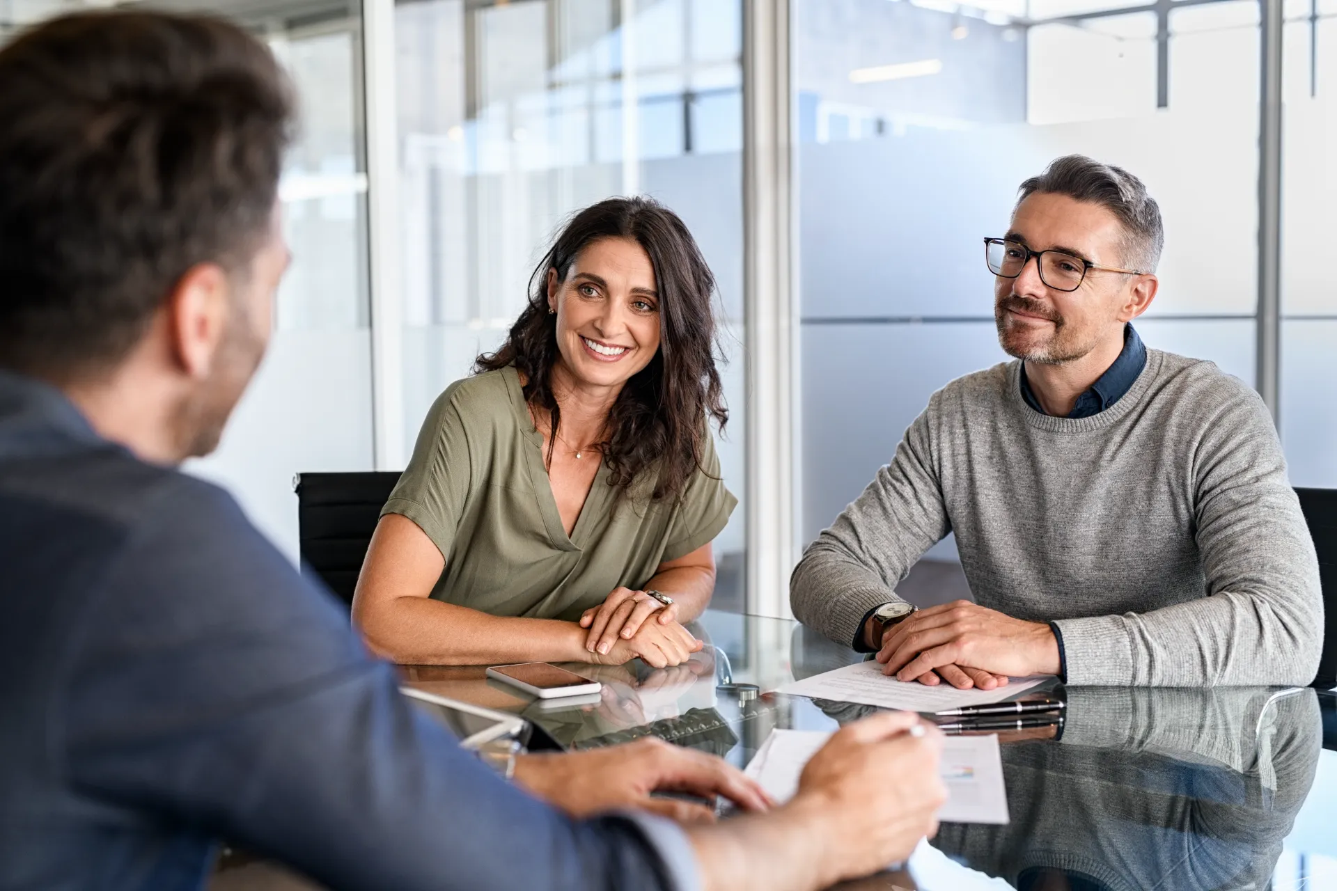 Couple meeting with a mortgage professional in an office